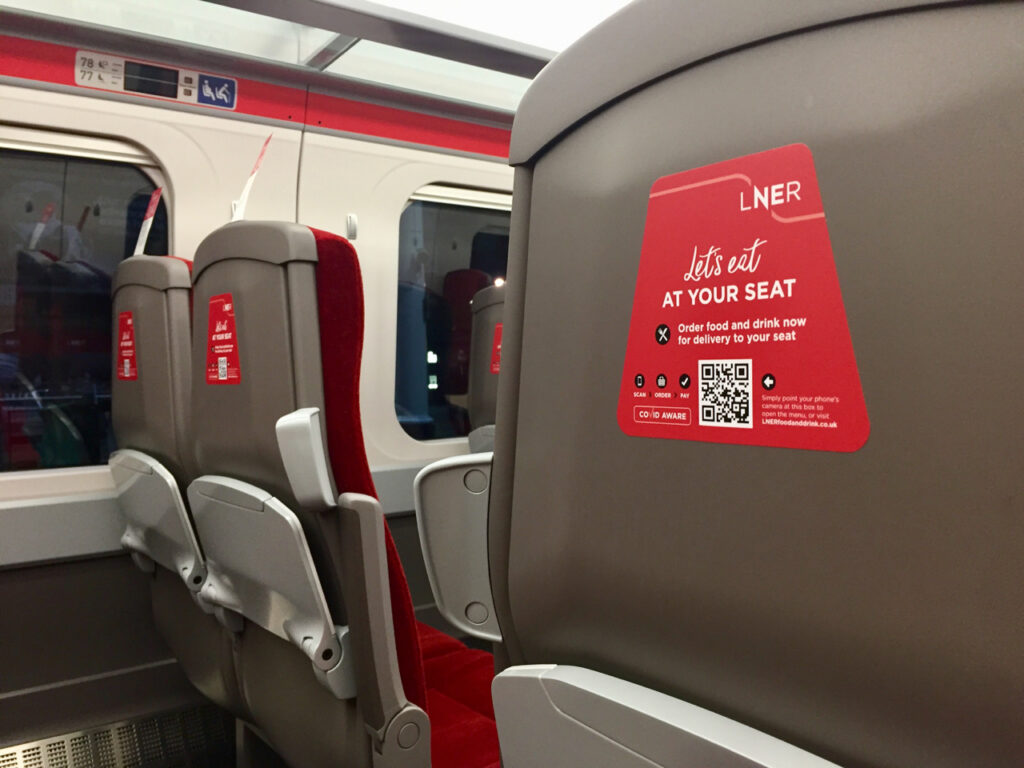 Image shows empty seats on an LNER train in February 2021.