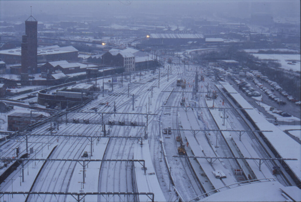 A snowy view across railway engineering work in Leeds.