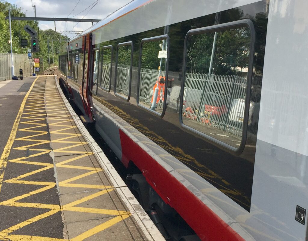 An electric train pauses at Chelmsford station.